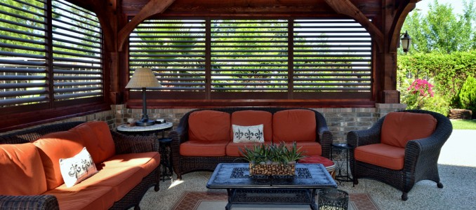 Palmetto Outdoor Spaces sells and installs aluminum shutters for creating an outdoor living space.